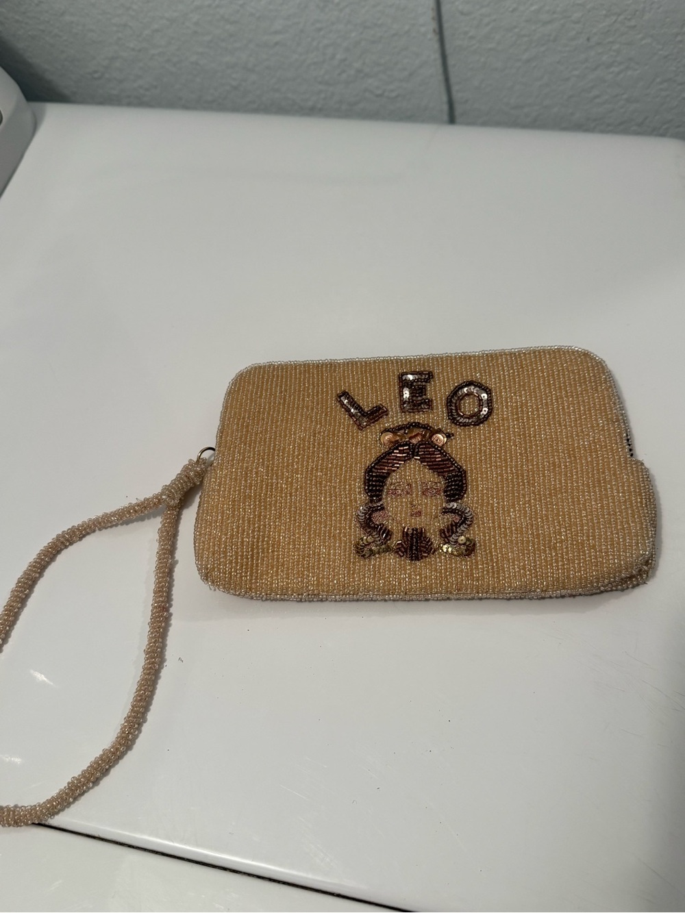 Anthropologie Beaded Leo Wristlet Clutch in Gold